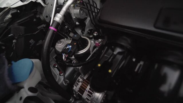 Closeup detailed view of new car engine compartment, Dolly shot
