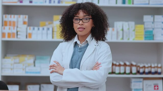 Portrait of proud intern with folded arms working in a modern pharmacy or drug store, confident and ready. Black woman satisfied with her new job in health care, competent and accomplished career