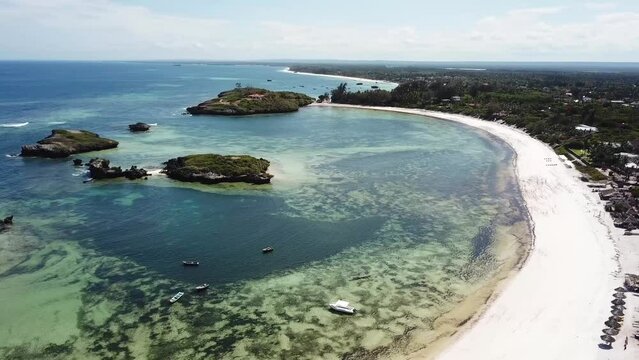 Exotic white sandy beach and rocky reef on Kenyan coast. Watamu - aerial drone, summer vacation.