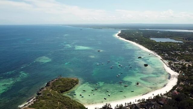 Spectacular aerial view of bay with tropical white sandy beach and popular holiday resort. Sunny day at Watamu, Kenya