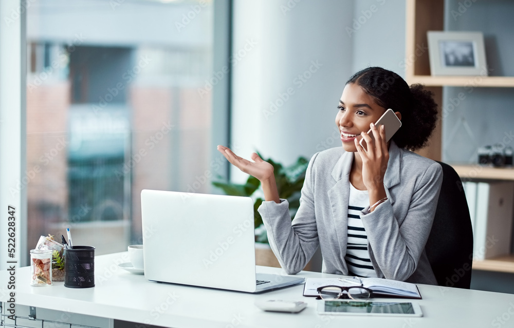 Poster business woman talking on phone call, networking and discussing a strategy while sitting at a desk a