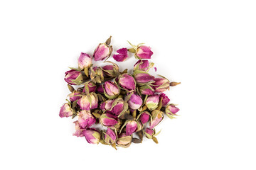 Dehydrated pink rose buds top down view isolated over white