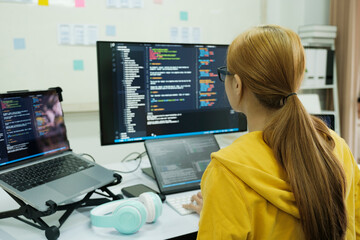 Programmer is coding and programming software.