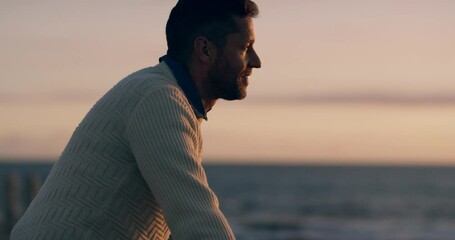 Thinking, calm and at peace man looking at the ocean or sea view on sunset beach with copy space background. Mature guy taking a break while enjoying fresh air outdoors in nature or on the promenade - Powered by Adobe