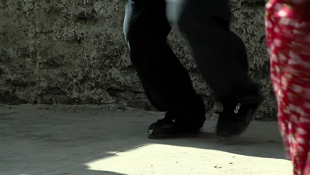 People Dancing Chacarera, an Argentine Folklore Dance originated in Santiago del Estero province, Argentina. Low Angle View. 