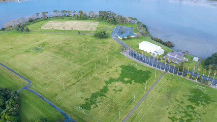 Aerial View from the Ocean, Forest, Green Trees, City Streets Football Soccer Field Seaside Park in Otahuhu, New Zealand - Auckland