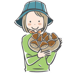 収穫した栗を紹介する作業姿の女性

