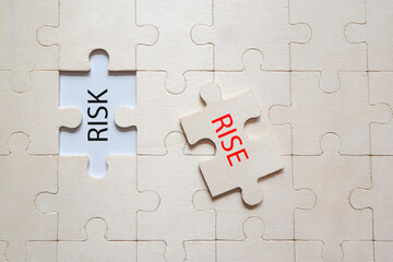 Risk and rise puzzle concept. The risky puzzle is overwritten and the reward is hidden.