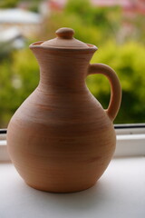 Fototapeta na wymiar Ceramics, a ceramic product made with your own hands, made on a potter's wheel, a jug, a mug, clay. 