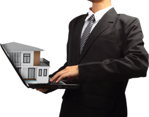 Business man using laptop with house model house concept