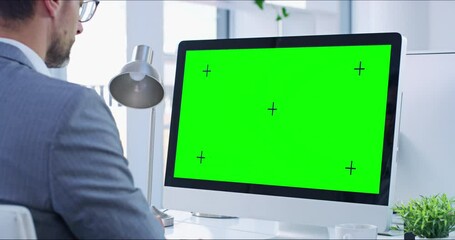 Greens creen, copyspace and chromakey on a computer screen with tracking markers and a business man working. Copy space for advertising, marketing and promotion with a corporate professional typing - Powered by Adobe