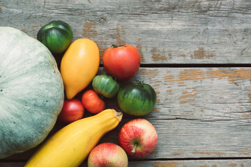 Organic farm vegetables and fruits on wooden table. Fresh autumn harvest concept. Top view, flat lay, copy space