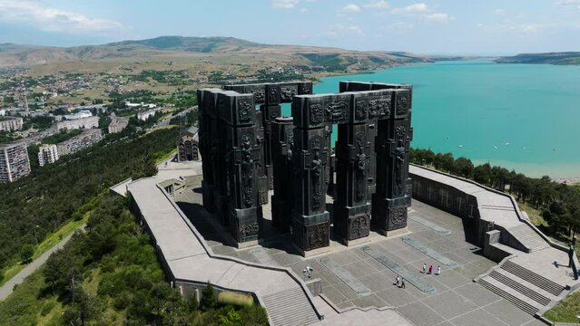 Chronicle of Georgia Monument Located Near The Tbilisi Sea In Georgia - aerial drone shot
