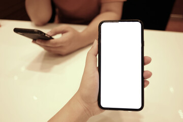 Women's hands holding cell telephone watching social media in a smart phone. social network concept with smart phone