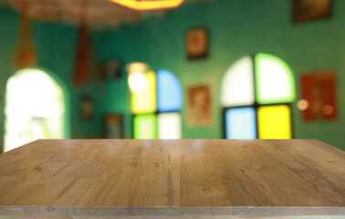 Empty wooden table in front of abstract blurred background of coffee shop . can be used for display or montage your products.Mock up for display of product