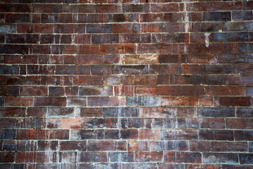 Close up texture and detail of old grunge red brick wall background