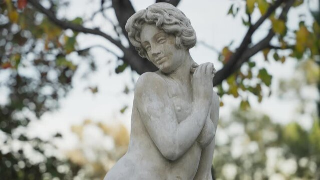 Timeless statue of a woman in the garden 