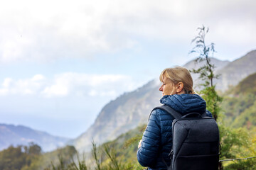 Naklejka na ściany i meble Tourist woman enjoing landscape of Madeira