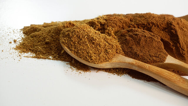 Powder Of Animal Feed Ingredient. Brown Powder On White. Shrimp Feed Ingredient As Protein