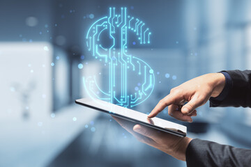 businessman hands holding and pointing at cellphone with abstract glowing blue circuit dollar hologram on blurry bokeh office interior background. Online banking and financial technology concept. 
