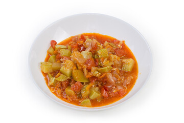 Vegetable marrow stewed with other vegetables in the white bowl