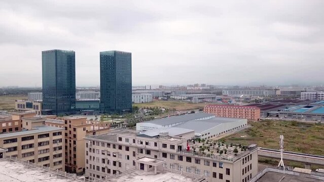 Drone Shots of Yiwu. City view, buildings, and factories on a cloudy day in Yiwu, China