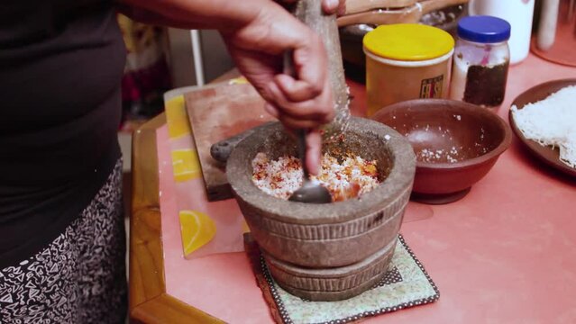 Making some Idiyappam, a traditional dish in Sri Lanka. Inside of a kitchen, making the traditional rice noodle dish.