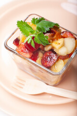 Bowl of healthy fresh fruit salad, close-up