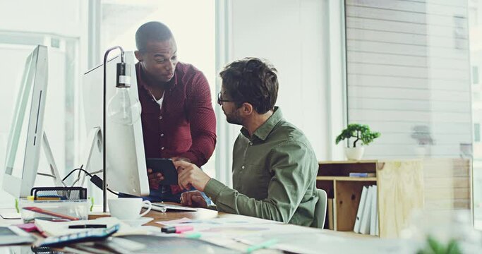 Teamwork, collaborating and happy digital marketers checking online app on a tablet while working in a modern office. Partners excited about a breakthrough or discovery, smiling while reading reviews