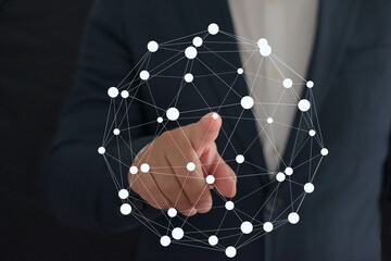 Businessman's finger touching a global network of worldwide connections.