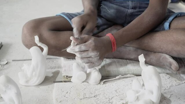 Closeup of a hand crafting statue, Mumbai, India