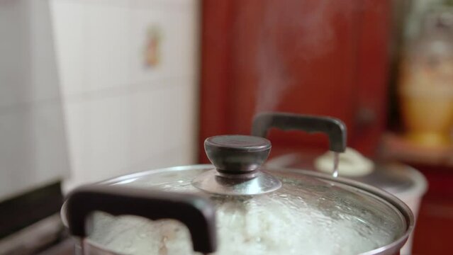 Making some Idiyappam, a traditional dish in Sri Lanka. Inside of a kitchen, making the traditional rice noodle dish.