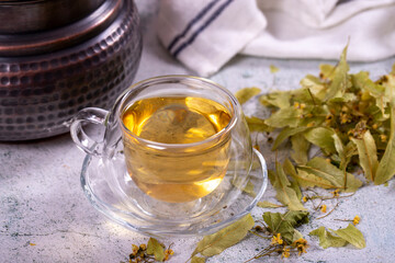 Linden tea. Linden tea on stone background. Herbal tea concept. Healthy drinks. close up
