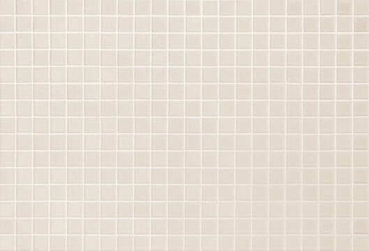 Cream light ceramic wall chequered and floor tiles mosaic background in bathroom. © siripak
