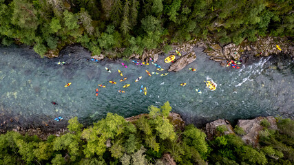 Group of friends spending time on the river enjoying kayaking and rafting together