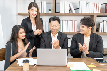 Businesspeople triumphing because of the financial growth of company. Happy smiling businesspeople triumphing with raised fists.