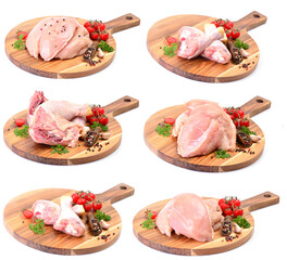 Chicken meat with spices and vegetables on a white background