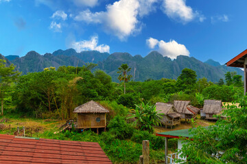 Vang Vieng Laos a beautiful city on the river with huge rising mountains and slow flowing river. 