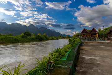 Vang Vieng Laos a beautiful city on the river with huge rising mountains and slow flowing river. 