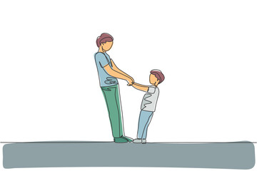 One continuous line drawing of young father and his son holding hands and dancing together at home, family life. Happy parenting concept. Dynamic single line draw design vector illustration graphic
