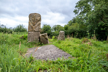 This is a bronze age stone carviing with two faces,called Janus, located In Caldragh Cemetery on...