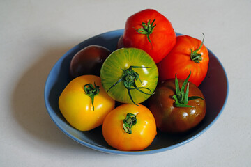 Bowl of colorful organic heirloom tomatoes