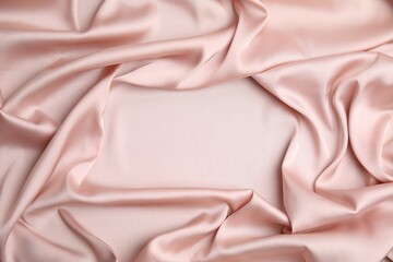 Texture of delicate pink silk as background, top view