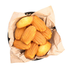 Delicious madeleine cakes in bowl on white background, top view