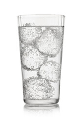 Lemonade sparkling mineral water with ice cubes and bubbles on white background.