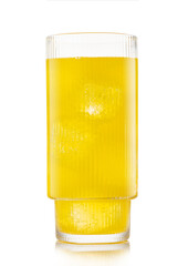 Glass of orange soft drink with ice cubes and bubbles on white background.