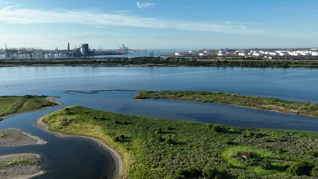 Green marshes at Oostvoornse Meer Aerial Drone Fly Above Rotterdam Port Holland