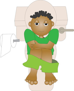 A boy sitting on the toilet