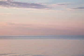 Fototapeta na wymiar Blurred background sea and sky at sunrise.