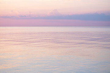 Fototapeta na wymiar Blurred background sea and sky at sunrise.